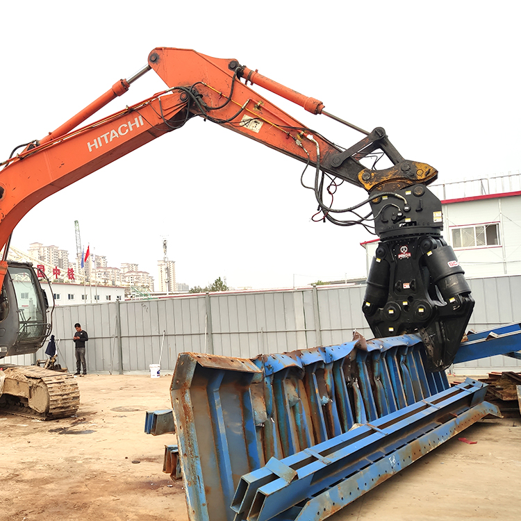 excavator hydraulic shear gripping large blue steel beams at demolition site
