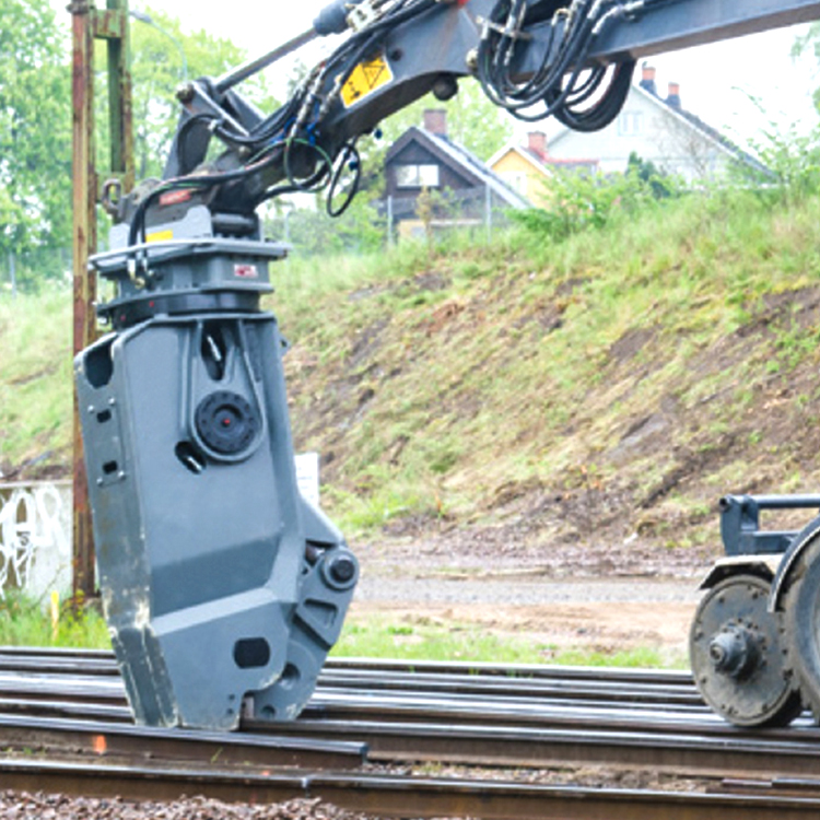 excavator rail cutter cutting railway track on site