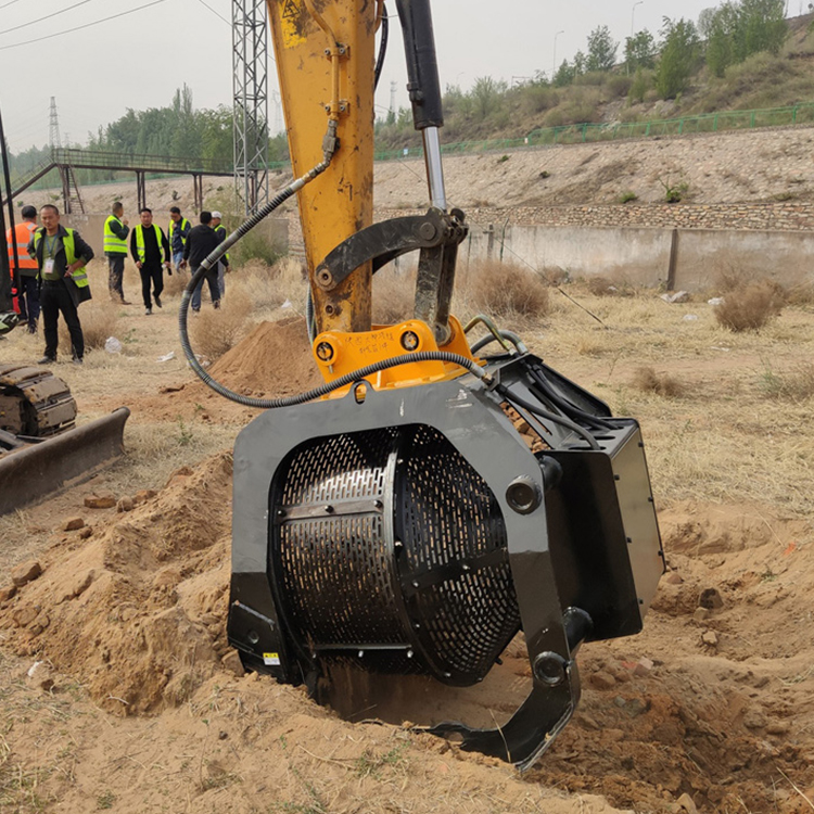 Trommel bucket dumping screened soil on-site