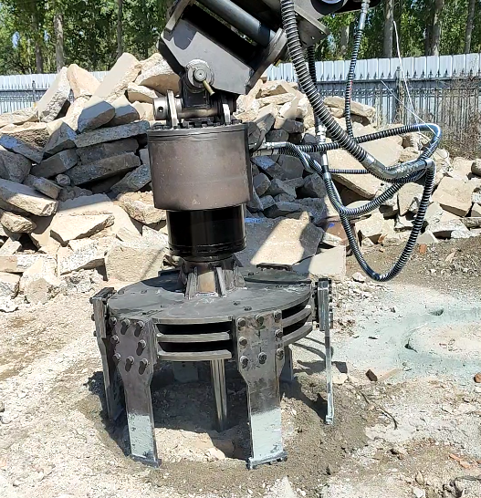 hydraulic manhole cutter attachment working around utility cover