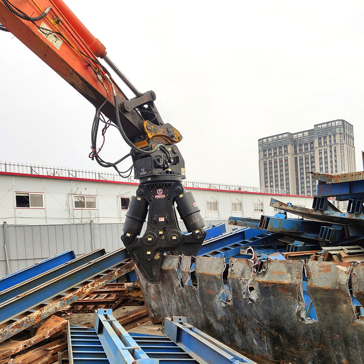 close-up excavator hydraulic shear cutting thick steel scrap