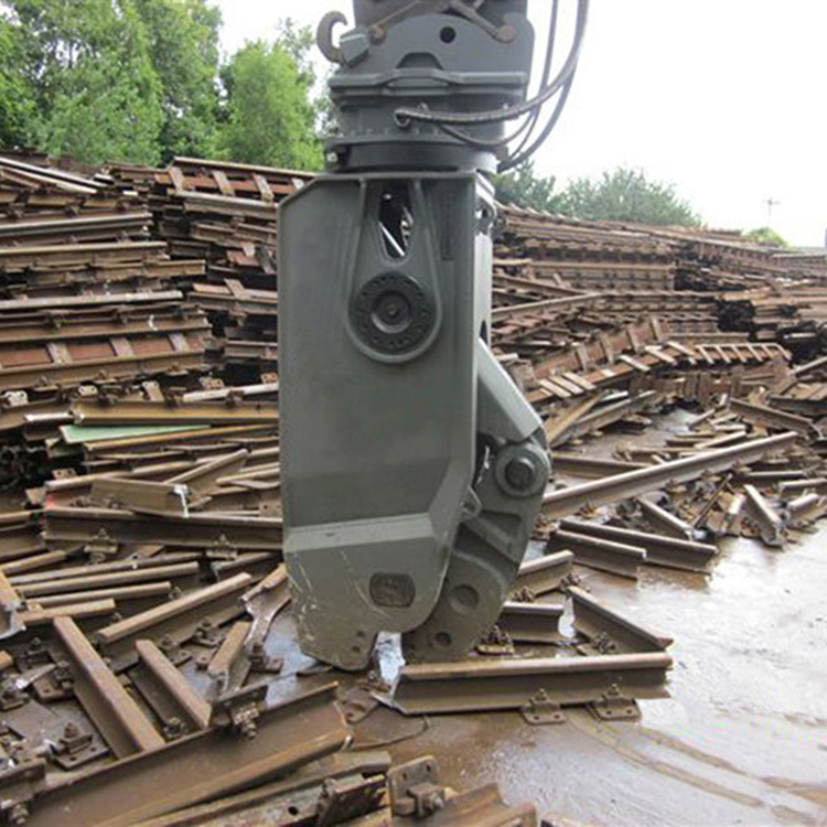 rail breaker working in scrap railway yard