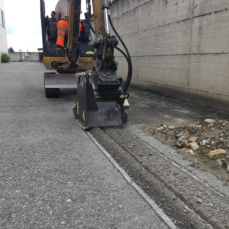 excavator cold planer milling trench edge on asphalt road
