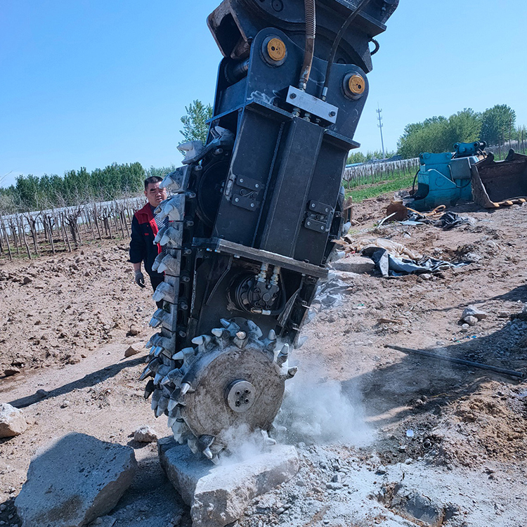 chain trencher attachment cutting rock on excavator jobsite
