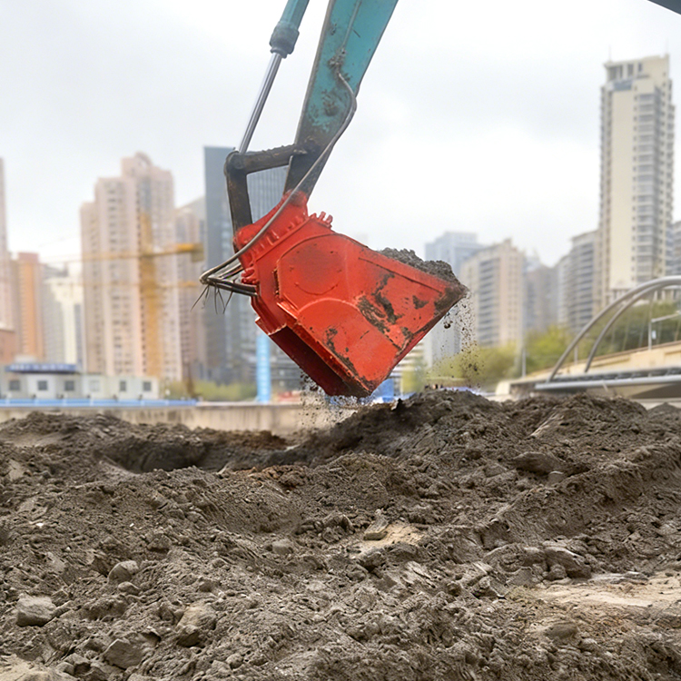 excavator screening bucket processing soil on construction site