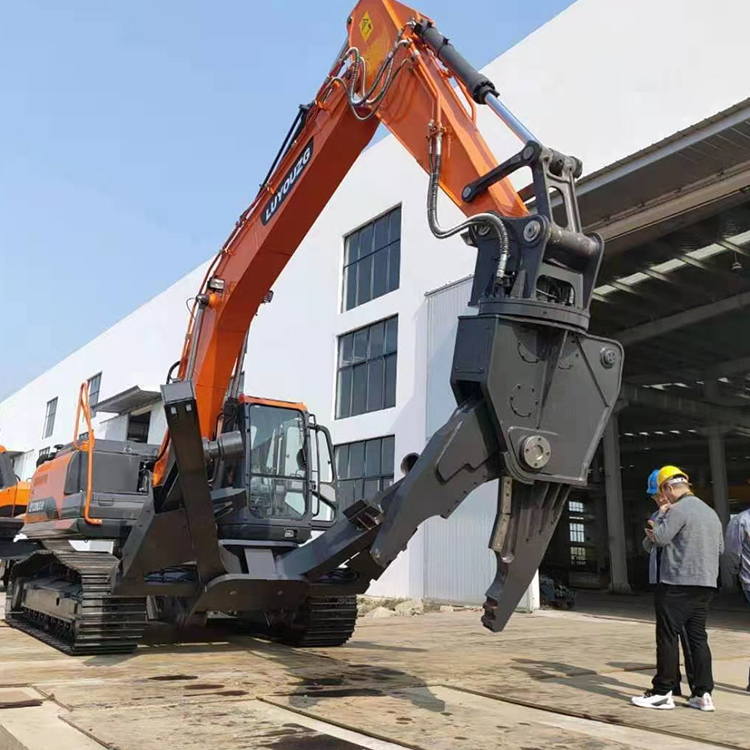 Car dismantling shear mounted on excavator outside the factory