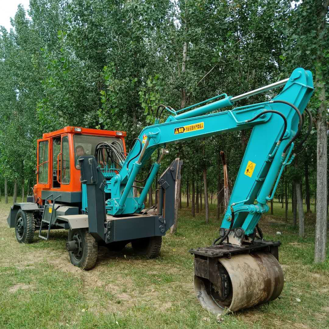 trench compaction wheel attachment installed on wheeled excavator in field