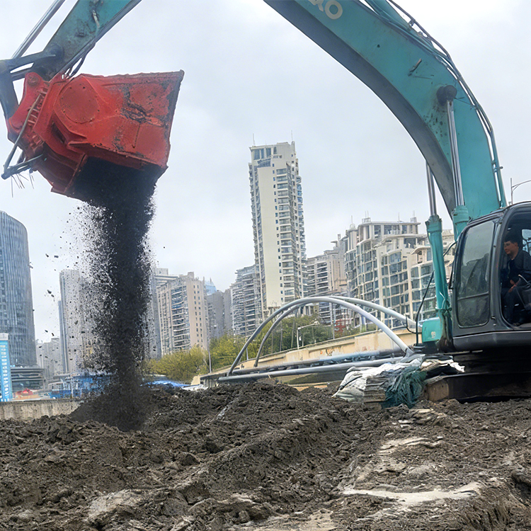 screening bucket releasing fine soil during excavator operation
