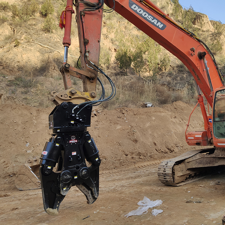 excavator hydraulic shear installed on machine at outdoor worksite