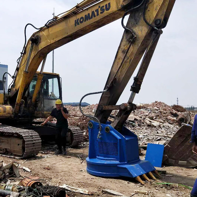 scrap magnet attachment on excavator at demolition site
