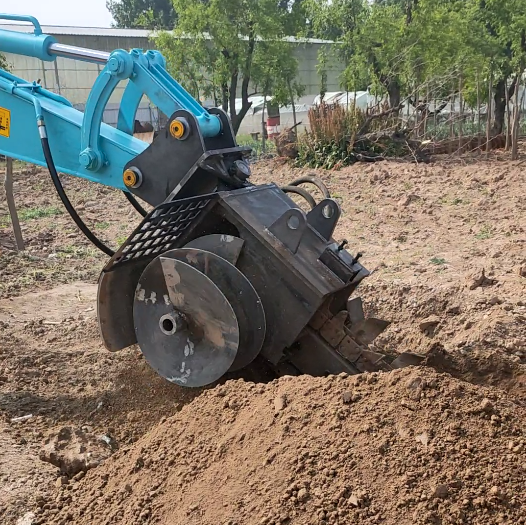 excavator trencher attachment digging a narrow trench in soil