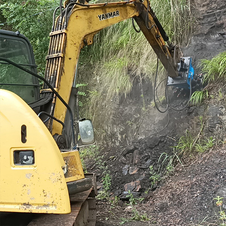 excavator drum cutter milling rock slope on jobsite