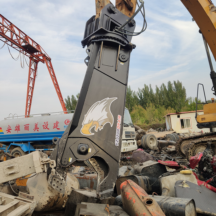 hydraulic shear close-up cutting scrap metal on demolition site