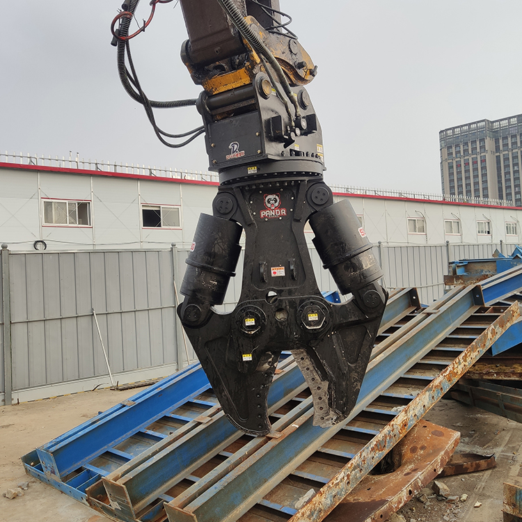 hydraulic shear attachment detail view above stacked steel frames