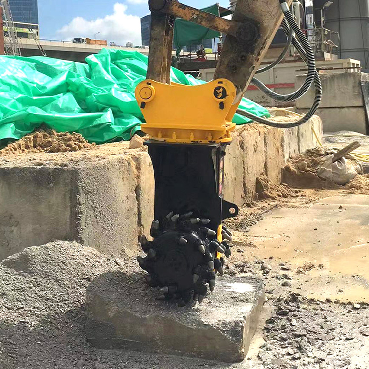 hydraulic milling cutter attachment working on concrete block