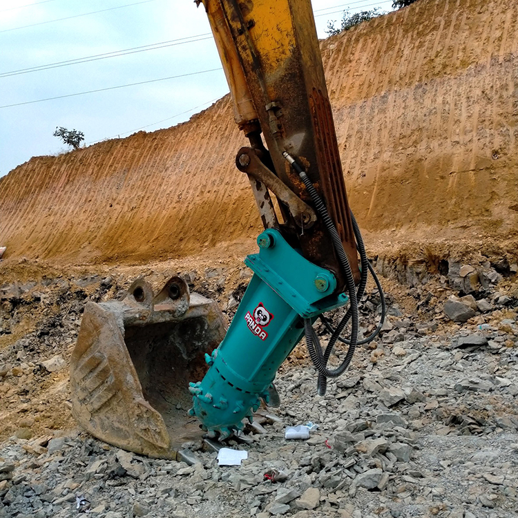 drum cutter attachment breaking rock in excavation site