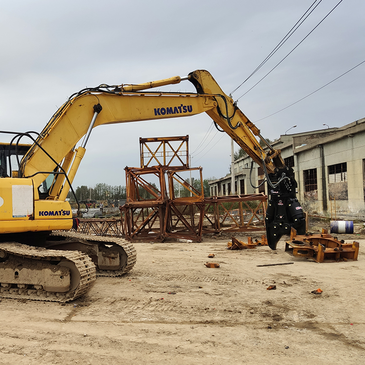 excavator scrap shear working in industrial yard for metal recovery