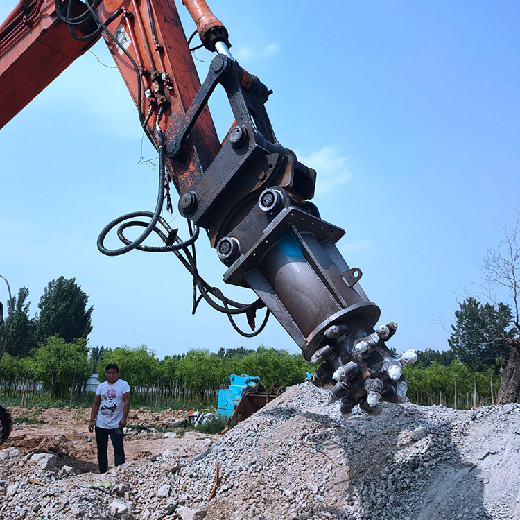 hydraulic rock grinder attachment working on rubble