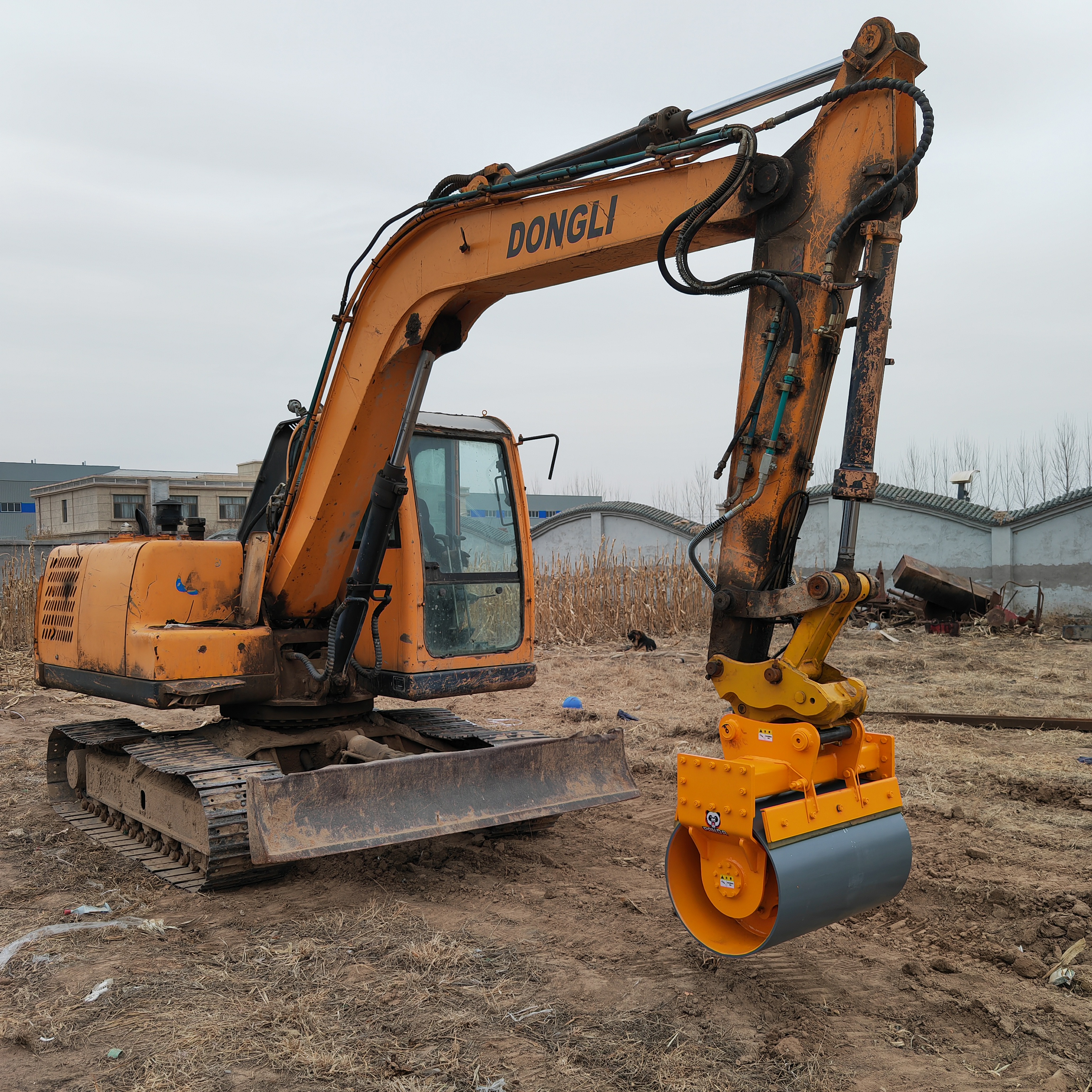 excavator compaction wheel side view mounted on excavator outdoors