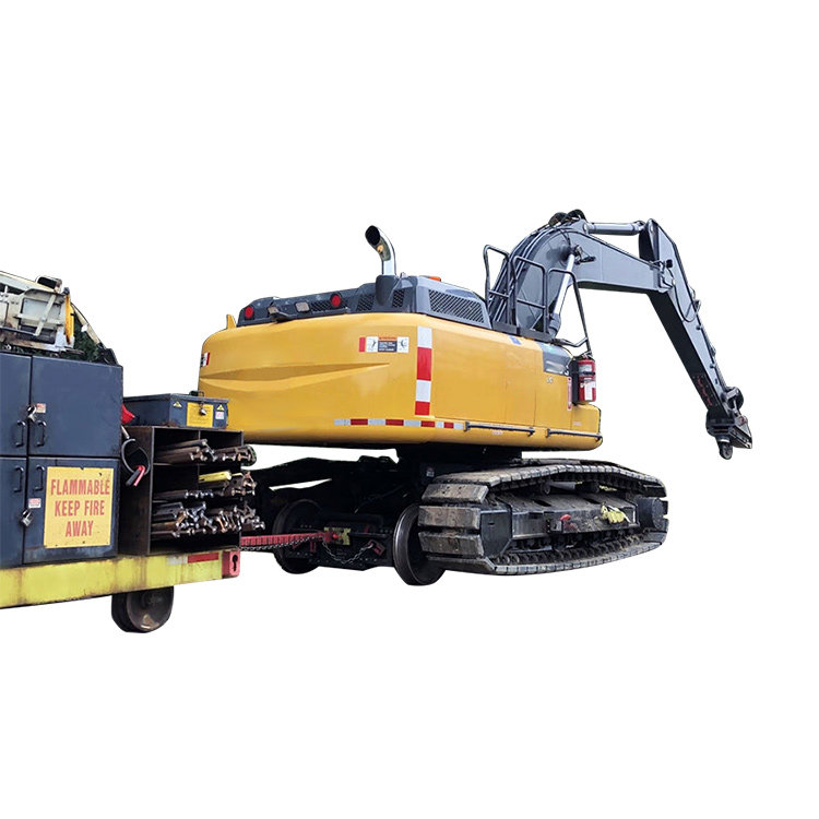 Railroad excavator on transport trailer rear side view