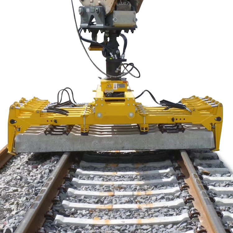 Rail Tie Inserter placing a concrete sleeper on track