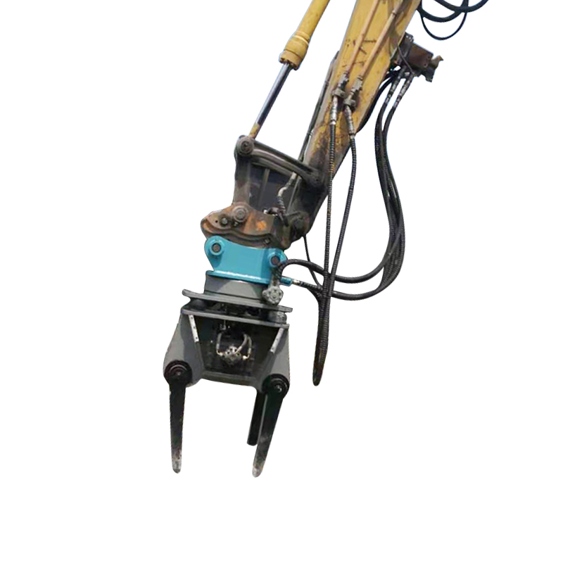 excavator-mounted ballast tamper attachment on excavator arm
