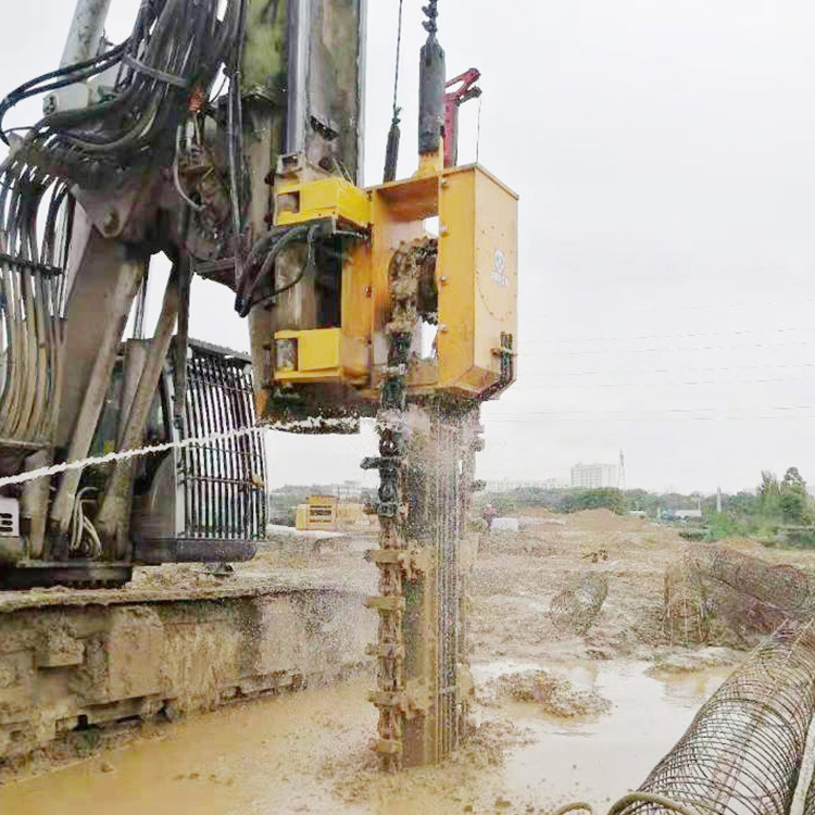 Trench Cutting Re-Mixing Deep Wall Machine working in muddy trench