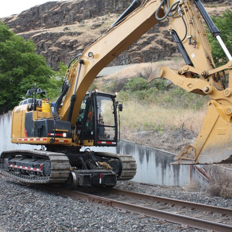 Railway excavator working beside railway track