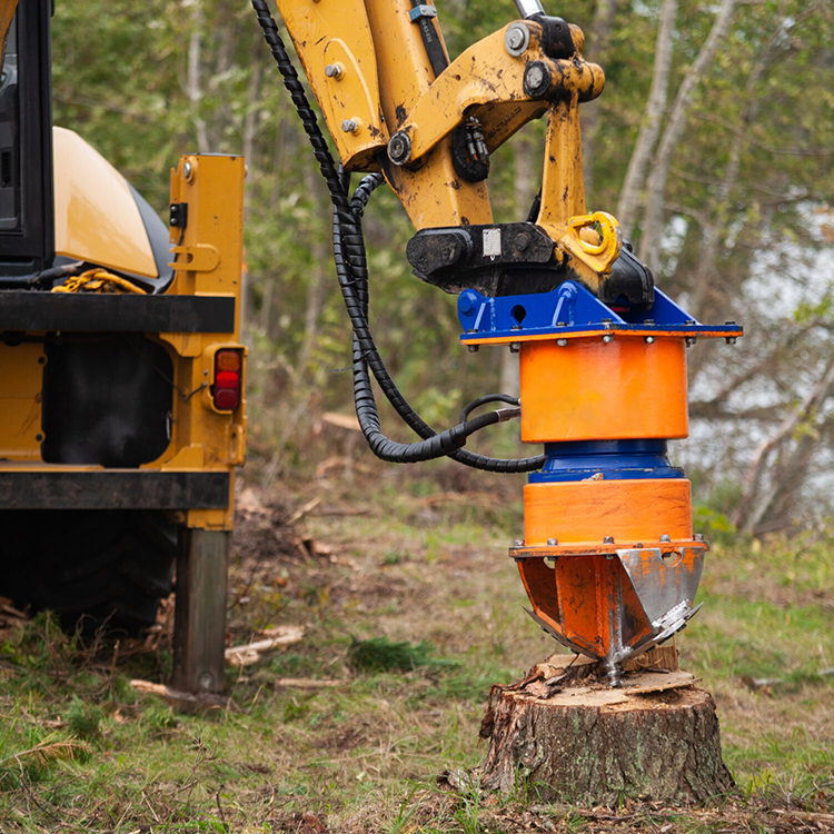 excavator stump grinder attachment removing tree stump in forest 