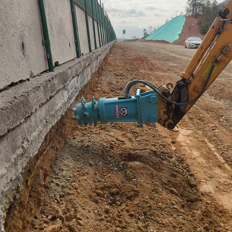 axial drum cutter trenching beside retaining wall