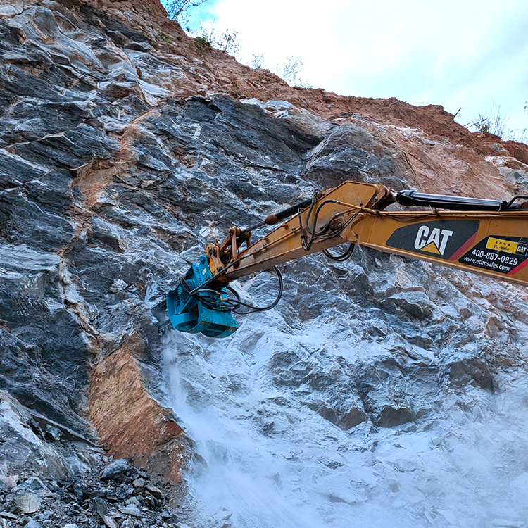 Rock Chain Trencher cutting rock wall