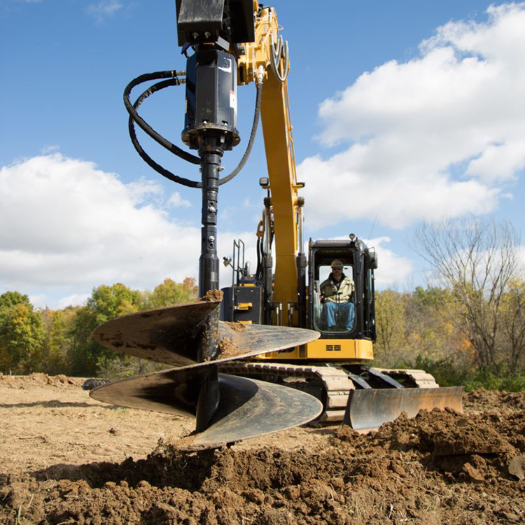 excavator drill attachment drilling on open site