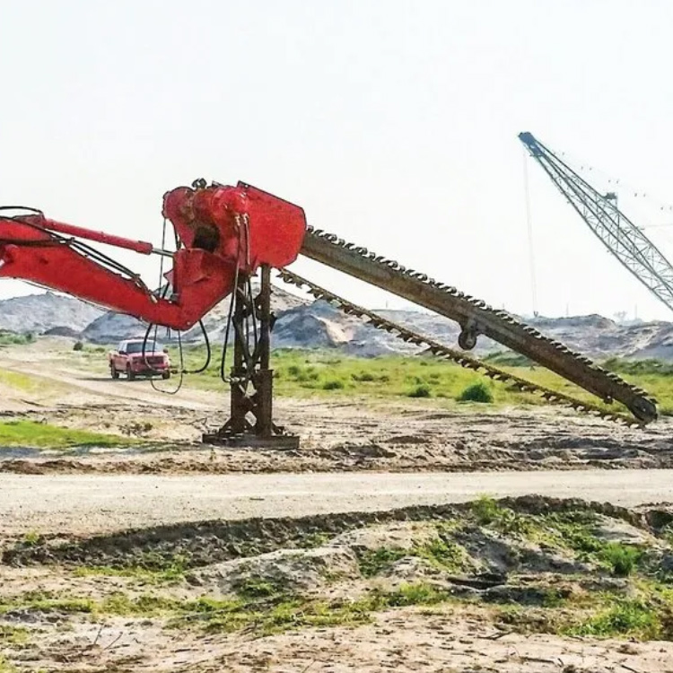 Soil Mixing Trencher attachment working in trench treatment area