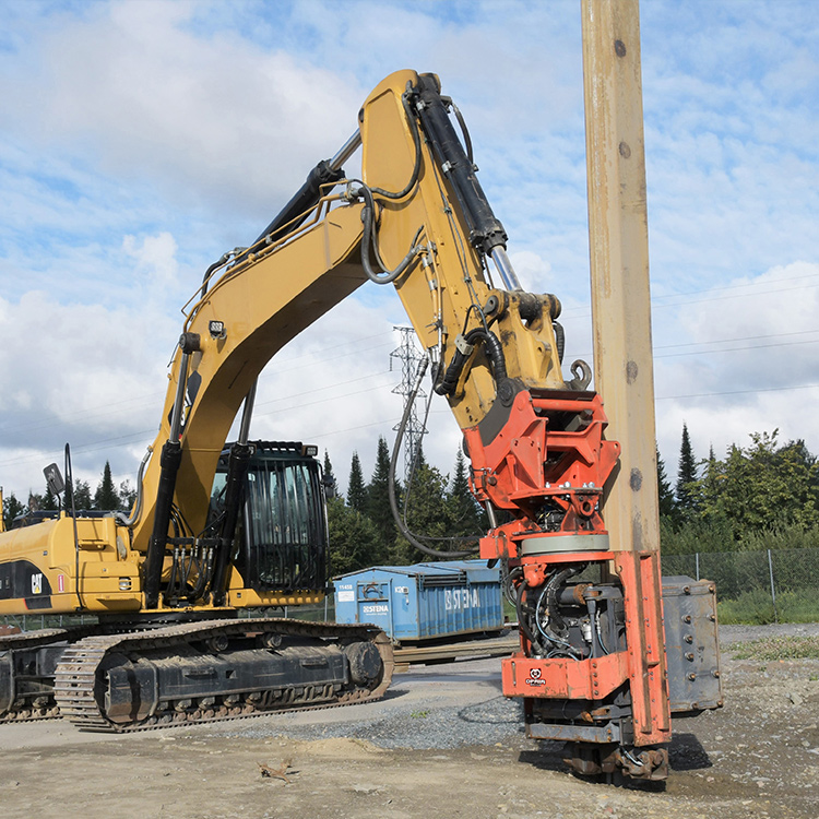 excavator mounted vibratory hammer driving pile on site
