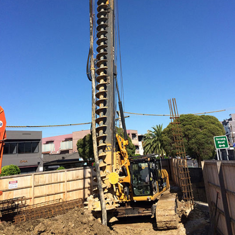cfa drilling rig operating on urban foundation construction site