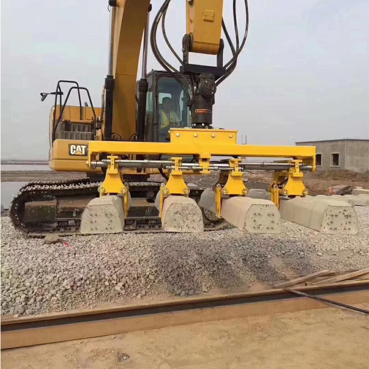 Tie Layer handling concrete railroad ties at construction site