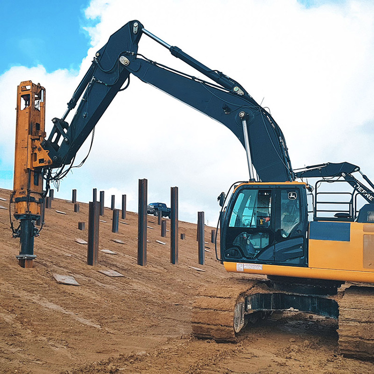 Excavator pile driver working on slope reinforcement project
