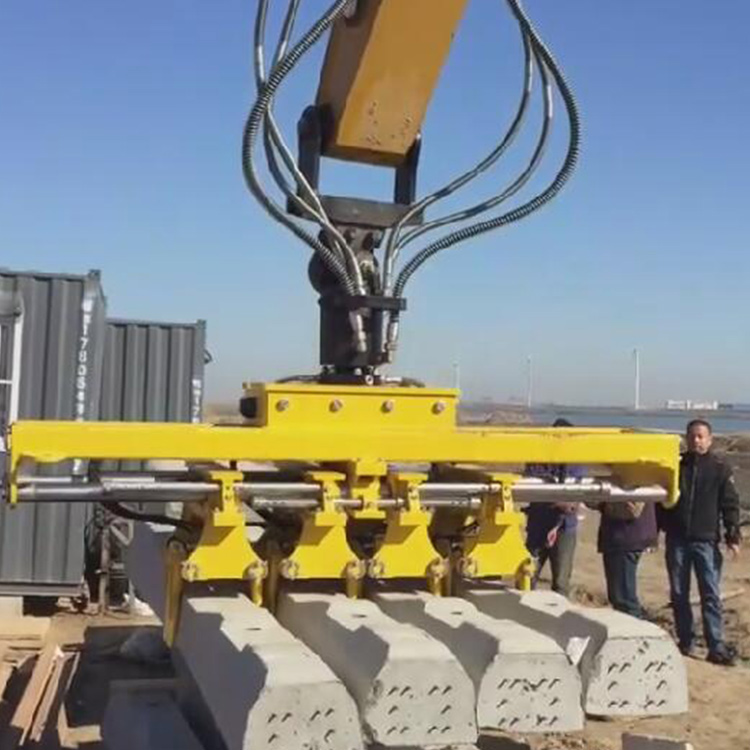 Hydraulic Sleeper Placer/Spacer lifting concrete sleepers outdoors