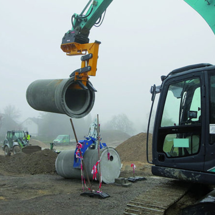 Excavator Pipe Laying Hook moving a concrete pipe on a construction site