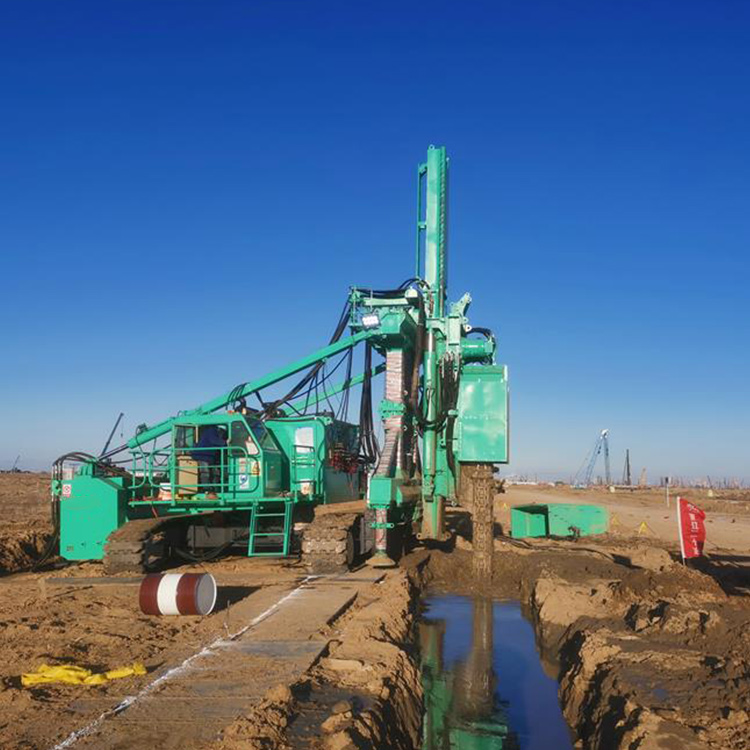 Underground Wall Forming Machine operating beside trench