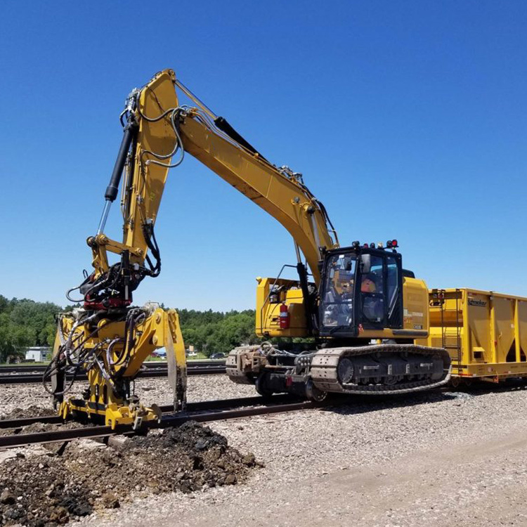 Railway maintenance excavator with specialized rail attachment