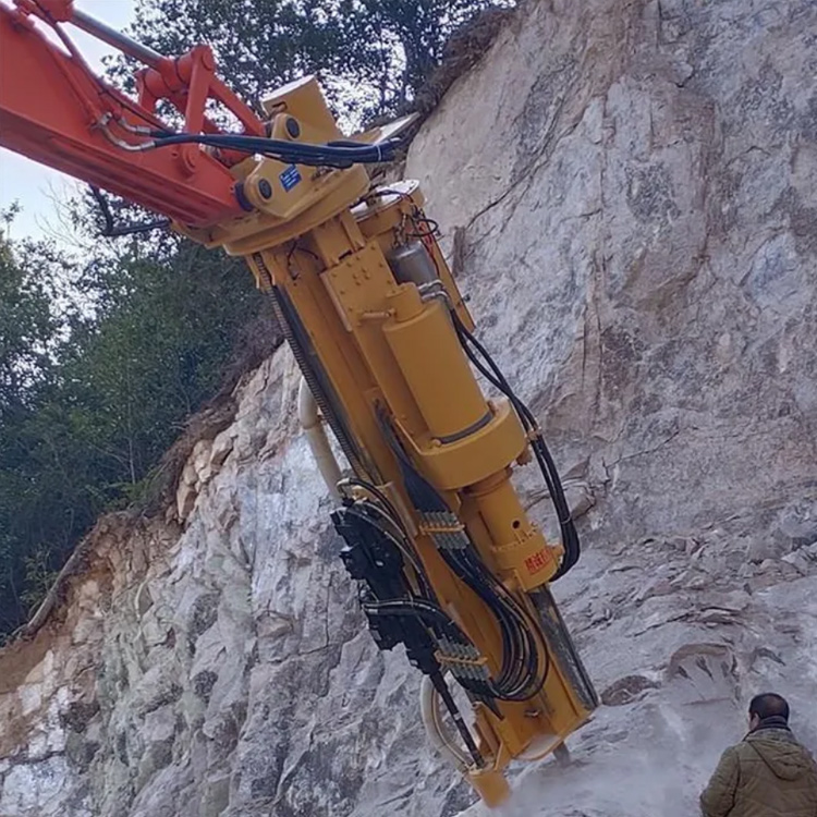 excavator rock drill and splitter attachment working on quarry rock face