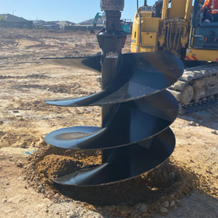 earth drill lifting soil from drilled hole