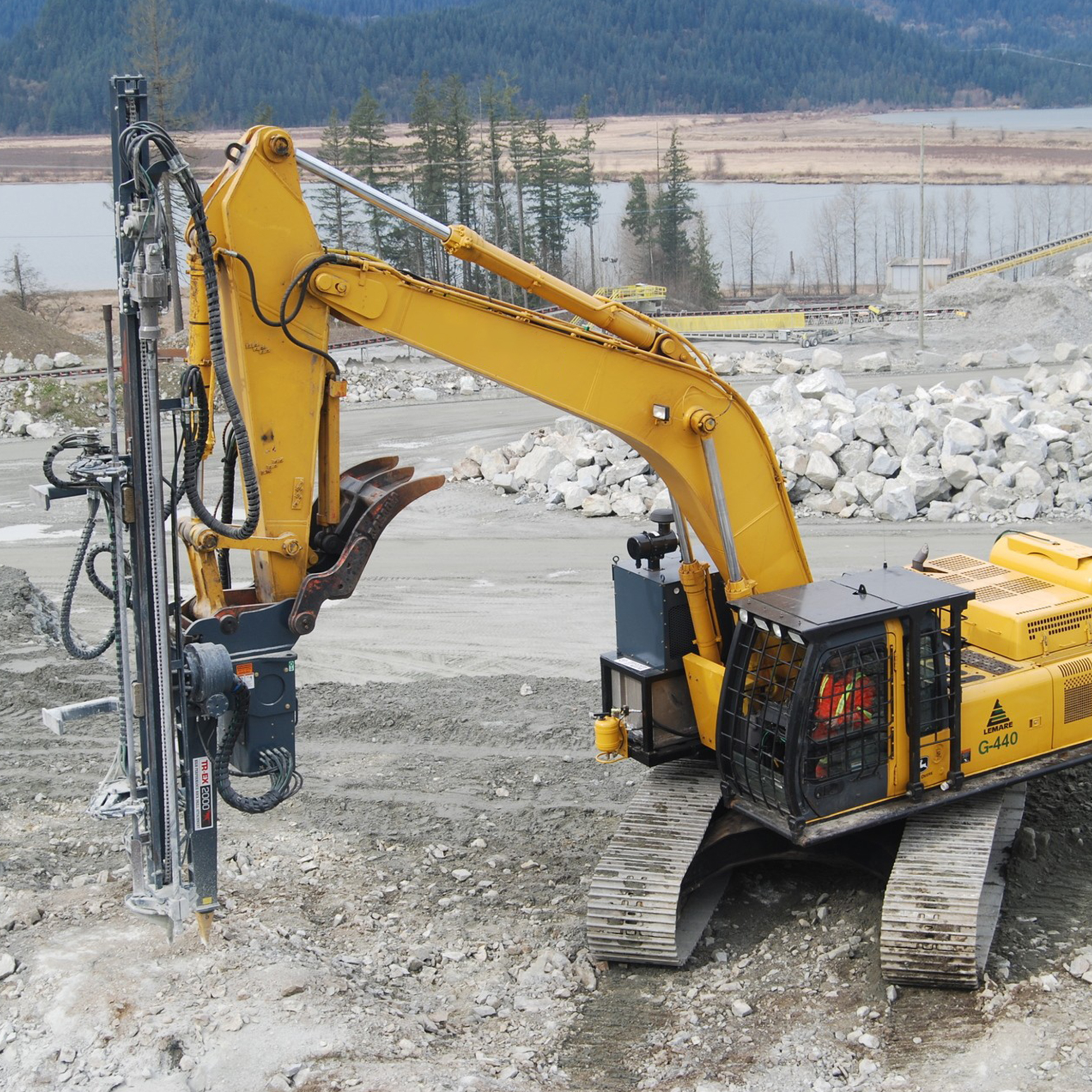 Blast Hole Drilling Rig on excavator in aggregate quarry