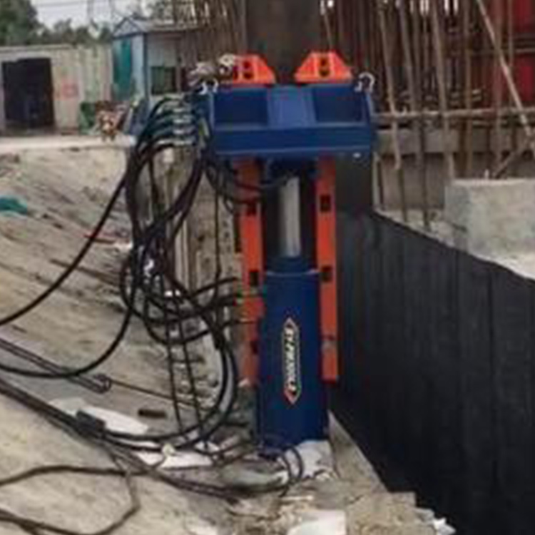 I-beam pile puller working in narrow excavation site