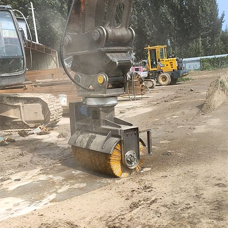 Rotary broom sweeper attachment operating on open yard surface