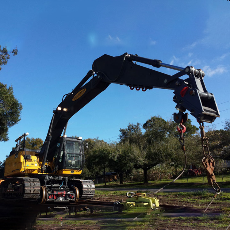 Dual-mode excavator with lifting attachment on railway line