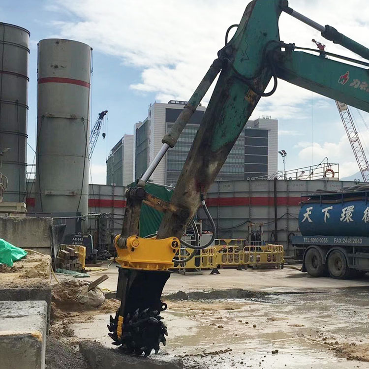 drum cutter attachment working in urban construction site