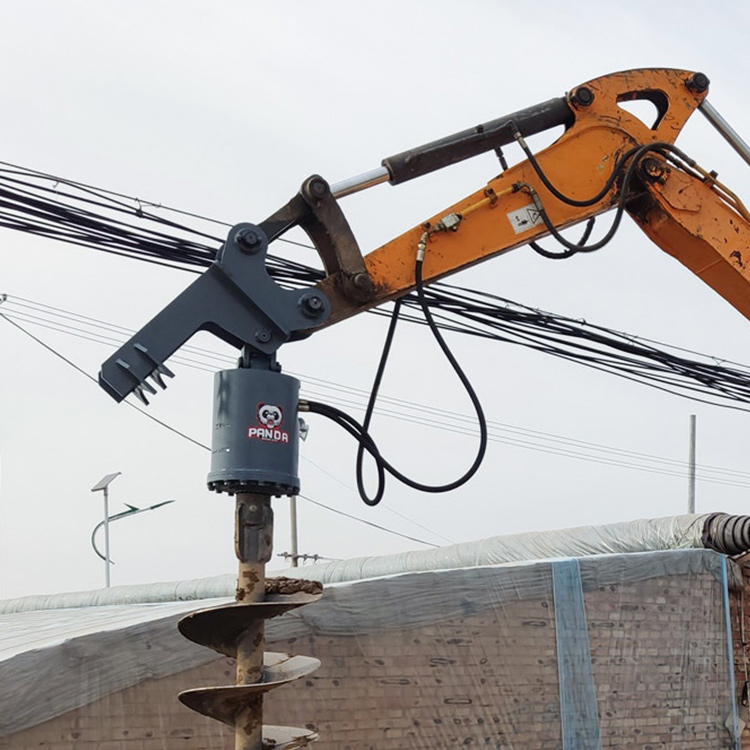 Excavator Post Hole Borer drilling attachment mounted on excavator arm