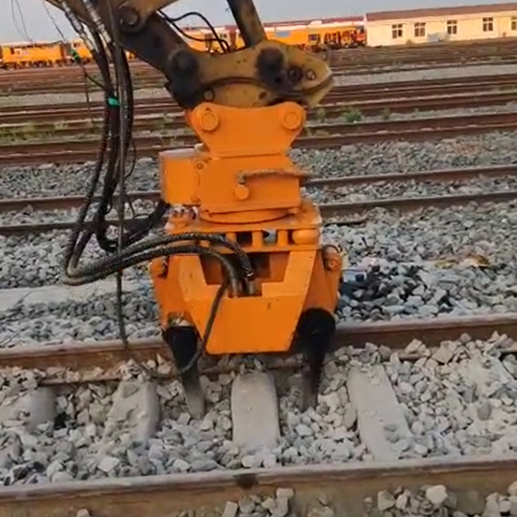railway ballast tamper compacting ballast between sleepers